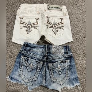Two pairs girls denim cut off shorts size 23.